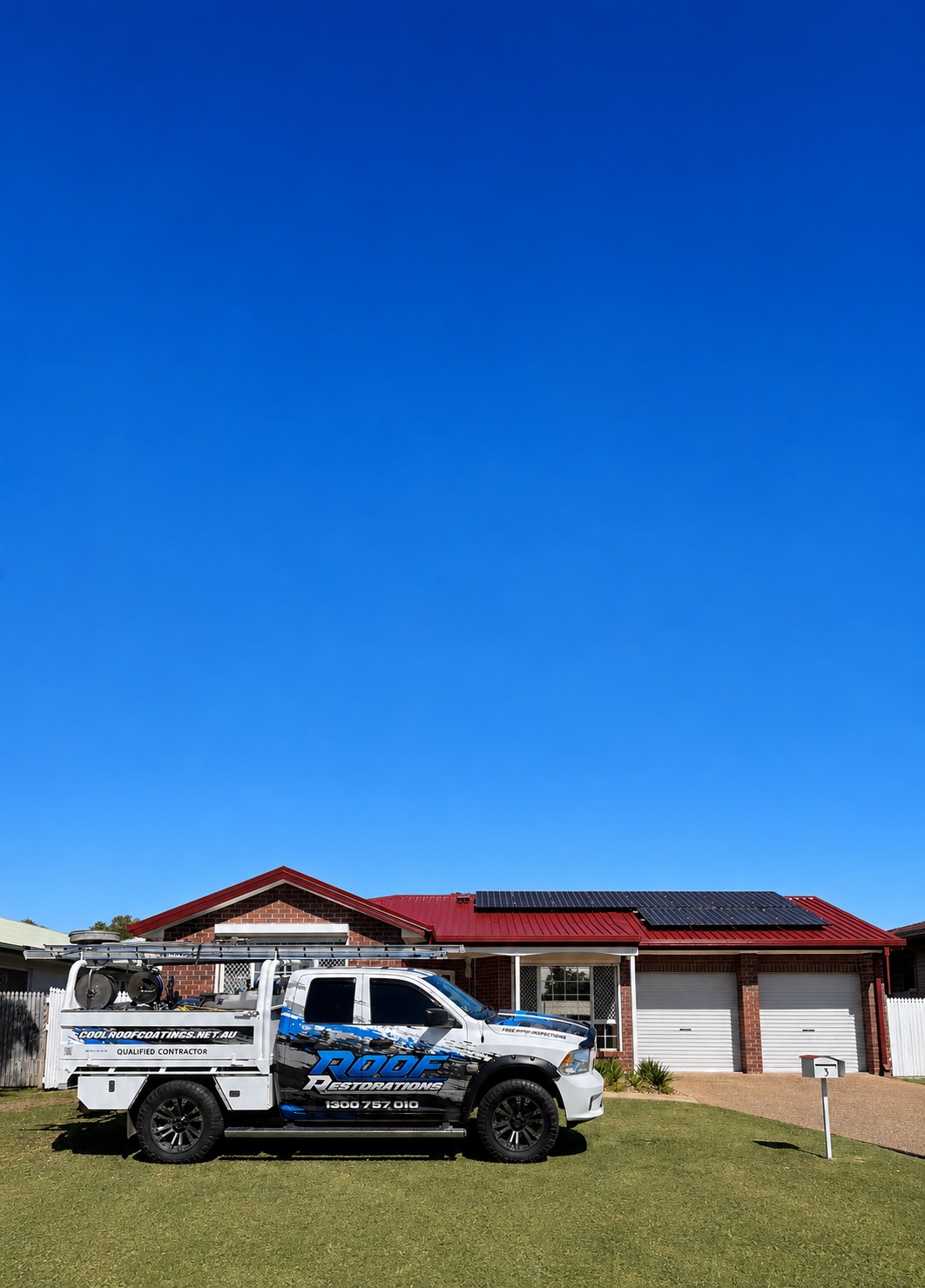 Cool Roof Coatings work truck parked in front of a restored red roof home